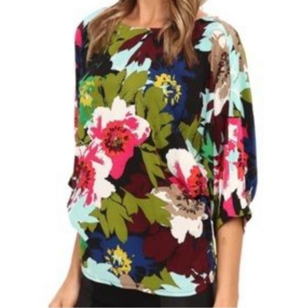 Trina Turk Dolman Sleeve Top 100% Silk Size Med
Like New Condition